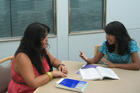 Alicia Mandac, CAS Academic Counselor and Peer Program Supervisor advising a student